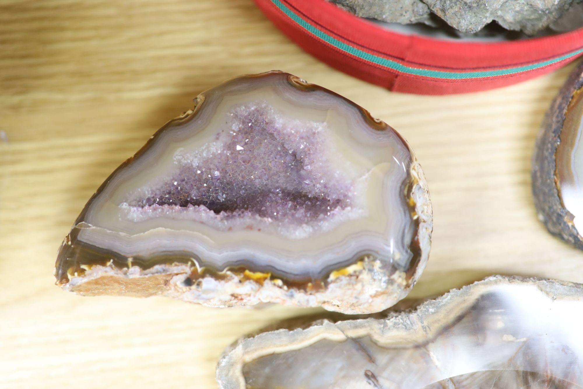 An amethyst geode section and assorted mineral specimens